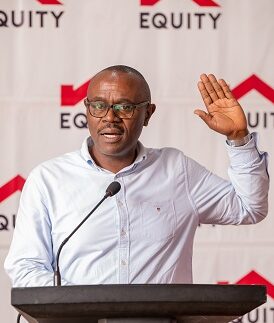 Nuhu Kanyike testifying during the Unilever- Equity Bank partnership launch at Sheraton Hotel Kampala