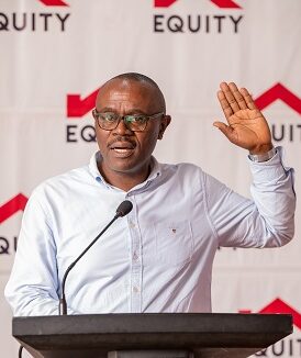 Nuhu Kanyike testifying during the Unilever- Equity Bank partnership launch at Sheraton Hotel Kampala